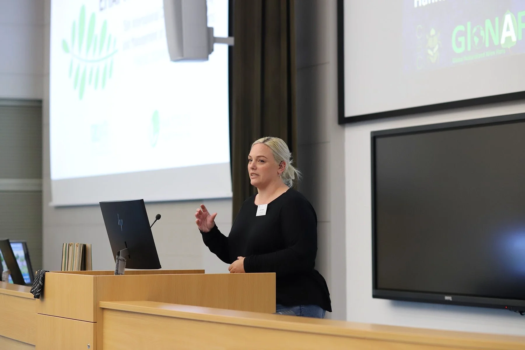 Zarah speaking at a conference